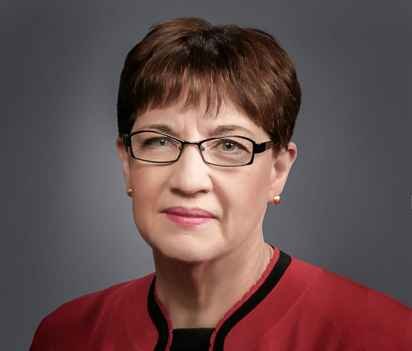 Attorney Patricia W. Christensen poses for a photo while wearing glasses